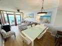 Open-concept living and dining area with stylish furnishings and breathtaking ocean views at 2007 S Ocean Blvd. # 1506, Myrtle Beach, SC 29577