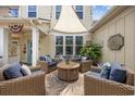 Cozy patio with comfortable seating, fire pit, and shade sail for outdoor relaxation at 2504 Heritage Loop # 2504, Myrtle Beach, SC 29577