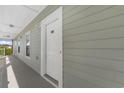 Exterior shot of a white apartment door with the number 302 at 3935 Gladiola Ct. # 302, Myrtle Beach, SC 29588