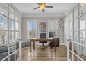Bright office space with hardwood floors, French doors, and a ceiling fan at 397 St. Julian Ln., Myrtle Beach, SC 29579