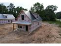 New home with simple porch and metal roof. Ready for a homeowner to customize at 402 S Magnolia Ave., Andrews, SC 29510