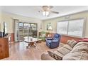 Relaxing living area with a view to the balcony with sliding glass doors that provide plenty of natural light at 4350 Intercoastal Dr. # 1101, Little River, SC 29566
