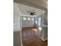 Bright living room featuring wood floors, shiplap wall accents, and abundant natural light at 493 Emerson Dr., Myrtle Beach, SC 29579