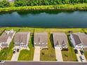 Aerial view showcasing homes along the water, with lush landscaping and private backyards at 560 Pier Ct., Longs, SC 29568