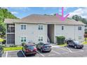 Condo building with well-maintained landscaping and assigned parking spots at 6309 Sweetwater Blvd., Murrells Inlet, SC 29576
