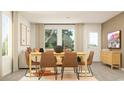 Inviting dining area with neutral decor, modern table and chairs, and lots of natural light at 6366 Swainson Street Sw, Ocean Isle Beach, NC 28469