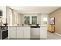 Bright, open kitchen with white countertops, stainless steel dishwasher and views to the living area at 6366 Swainson Street Sw, Ocean Isle Beach, NC 28469