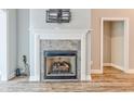 Elegant fireplace with a decorative mantel and tiled surround, adding warmth to the room at 648 Sunnyside Dr. # 102, Murrells Inlet, SC 29576