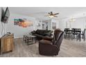 Spacious living room with comfortable leather furniture and new flooring at 800 9Th Ave. S # E-4, North Myrtle Beach, SC 29582