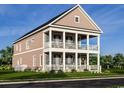 Beautiful two-story home with double porches, white railings, and shutters with great curb appeal at 8163 Wood Pass Lane, Myrtle Beach, SC 29572
