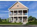 Inviting two-story home boasting double porches with white railing and beautiful outdoor landscaping at 8163 Wood Pass Lane, Myrtle Beach, SC 29572