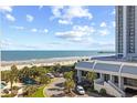 Coastal condominium with a beautiful ocean view and palm trees at 9820 Queensway Blvd. # 502, Myrtle Beach, SC 29572