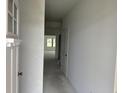Bright entryway with white walls and trim, showcasing the home's open floor plan at 1021 Jase Dr., Longs, SC 29568