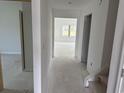 Spacious hallway offering a glimpse into the well-lit interior and stairs, highlighting the home's layout at 1021 Jase Dr., Longs, SC 29568