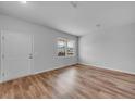 Bright bedroom featuring wood-look flooring, and a large window at 1046 Laconic Dr., Myrtle Beach, SC 29588