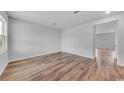 Bright bedroom featuring wood-look flooring, and a large window at 1046 Laconic Dr., Myrtle Beach, SC 29588