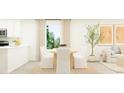 Light and airy dining area with a modern table, white chairs, and natural light flowing through the window at 1222 Willow Oaks Way, Conway, SC 29526