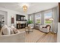 Bright living room featuring neutral furniture, stylish decor, and large windows with natural light at 1523 Wood Stork Dr., Conway, SC 29526