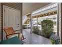Cozy porch with rocking chair and view of the well-kept condo community at 141 Lazy Willow Ln. # 103, Myrtle Beach, SC 29577