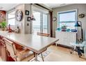 Kitchenette with light countertops, tile backsplash, natural light, seating and ocean views at 1615 S Ocean Blvd. # 4, Surfside Beach, SC 29575