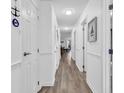 Bright hallway with wood floors, white walls, and access to living areas at 1870 Auburn Dr. # 22A, Surfside Beach, SC 29575