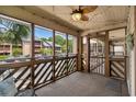 Relaxing screened-in porch with ceiling fan, string lights, and comfortable seating area at 223 Maison Dr. # B-8, Myrtle Beach, SC 29572
