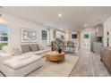 Spacious living area with open floorplan connecting to kitchen featuring modern design at 226 Carver Willow Dr., Loris, SC 29569