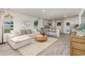 Open-concept living space with a cozy sofa, adjacent to the well-equipped kitchen and dining area at 226 Carver Willow Dr., Loris, SC 29569