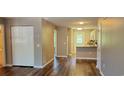 Inviting living room boasts wood-look floors, neutral paint, and opens to kitchen at 2407 James St. # 401, Conway, SC 29527