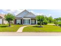 Lovely home with brick accents, manicured landscaping and winding walkway at 2499 Burning Tree Ln., Little River, SC 29566