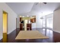 Open-concept living room featuring vaulted ceiling and hardwood floors at 2499 Burning Tree Ln., Little River, SC 29566