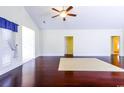 Bright and airy living room with ceiling fan and hardwood floors at 2499 Burning Tree Ln., Little River, SC 29566