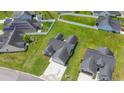 Aerial view of a home with a large yard, showcasing the home's location and surrounding neighborhood at 282 Foxpath Loop, Myrtle Beach, SC 29588