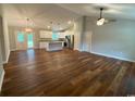 Spacious living room featuring hardwood floors, modern lighting, and an open layout at 3204 Fowler School Rd., Loris, SC 29569