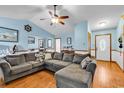 Spacious living room with hardwood floors, comfortable seating and natural light at 405 Flagstone Dr., Myrtle Beach, SC 29588