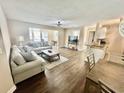 Open-concept living room featuring modern furnishings, a ceiling fan, and bright dining area at 4370 Crepe Myrtle Ct. # F, Murrells Inlet, SC 29576