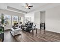 Spacious living room with tray ceilings, recessed lighting, and wood flooring at 447 Honeyhill Loop, Conway, SC 29526
