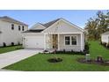 Charming single-story home with a gray exterior, well-manicured lawn, and a two-car garage at 4846 Hopespring St., Myrtle Beach, SC 29579