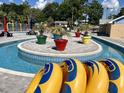 Close up of lazy river showing potted palm trees and tubes for riding at 5905 S Kings Hwy. # 206A, Myrtle Beach, SC 29575