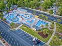 Aerial view of a neighborhood waterpark with lazy river, slides, picnic area and parking at 5905 S Kings Hwy. # 206A, Myrtle Beach, SC 29575