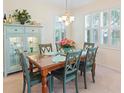 Cozy dining area featuring a wooden table, seating for six, and a decorative china cabinet at 601 Hillside Dr. N # 1931, North Myrtle Beach, SC 29582