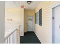 A welcoming entryway with an 'EXIT' sign, leading to a door numbered 1931 at 601 Hillside Dr. N # 1931, North Myrtle Beach, SC 29582
