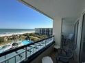 Relaxing balcony view overlooking the ocean and community pool area at 601 Retreat Beach Circle # 521, Pawleys Island, SC 29585