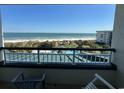 Breathtaking balcony view of the beach and community pool area at 601 Retreat Beach Circle # 521, Pawleys Island, SC 29585