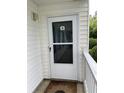 Entrance door with glass pane, secured with a screen, allows natural light into your home at 770 Charter Dr. # C4, Longs, SC 29568