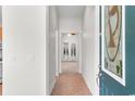 Inviting entryway featuring a decorative glass sidelight and durable tile flooring throughout at 821 Laquinta Loop, Murrells Inlet, SC 29576
