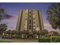 High-rise condo building exterior at dusk showcasing beautiful sky and balconies at 8560 Queensway Blvd. # 106, Myrtle Beach, SC 29572