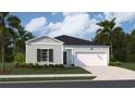 Inviting single-story home with light blue siding, a dark roof, and a well-manicured front yard at 863 Long Beach Dr, Longs, SC 29568