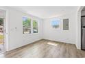 Bright living room with sleek flooring and ample natural light from large windows at 1004 Georgetown St., Marion, SC 29571