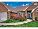 Beautiful brick home featuring manicured landscaping and an inviting entrance at 1017 Coral Reef Dr., North Myrtle Beach, SC 29582